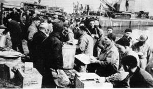 Seabees from the 38th NCB line up for their first meal at Kiska